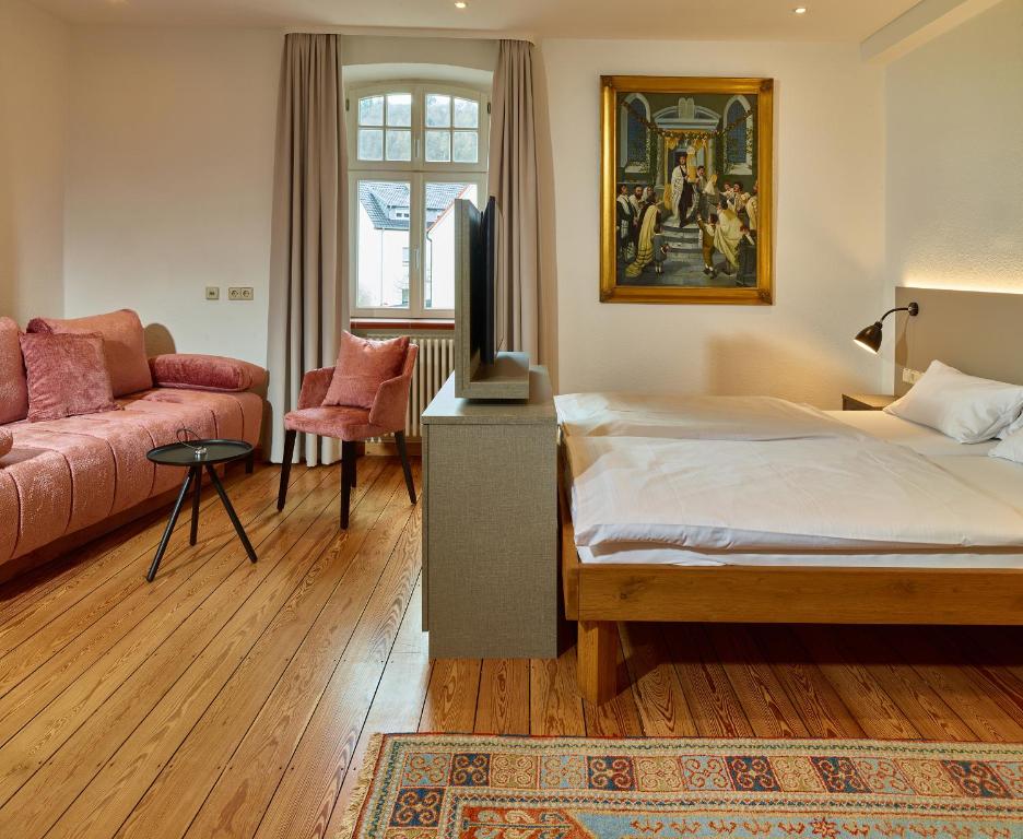 Postel nebo postele na pokoji v ubytování Hotel & Restaurant Burgschänke
