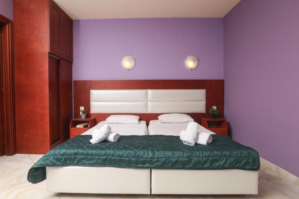 Postel nebo postele na pokoji v ubytování Kerkyra Beach Hotel & Apartments