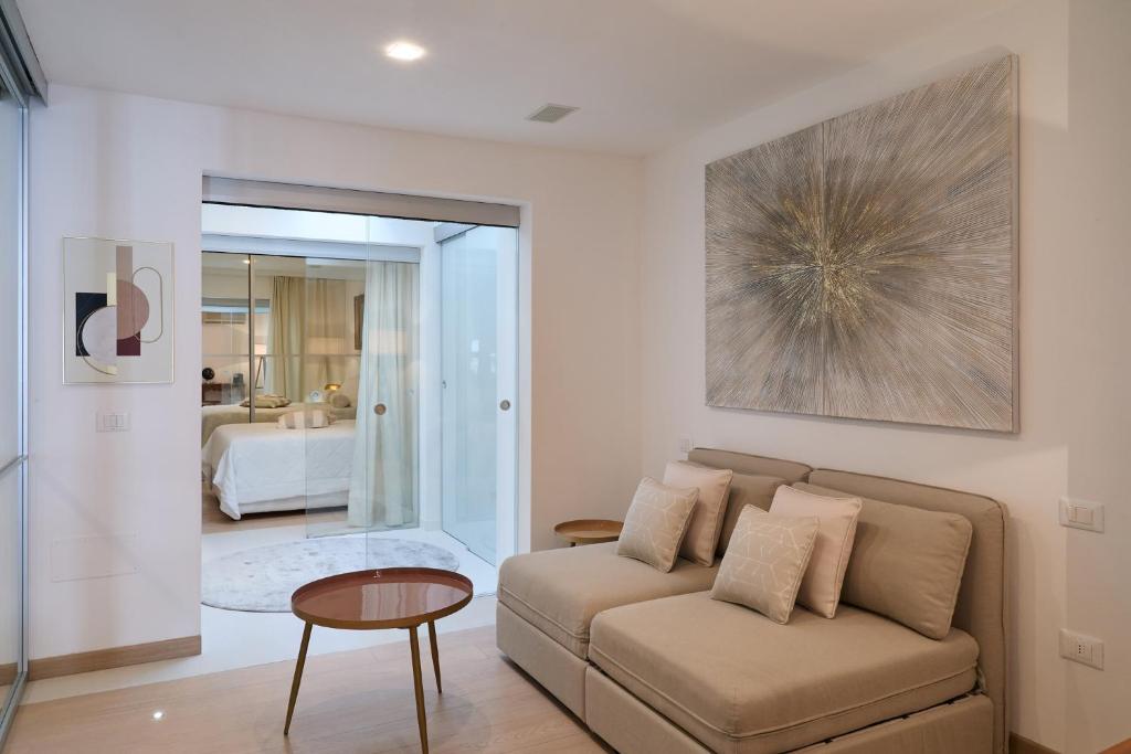 a living room with a couch and a table at Mari Lifestyle in Fano