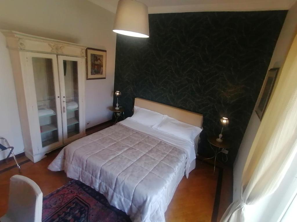 Posteľ alebo postele v izbe v ubytovaní B&B Buon Cammino Tuscia Viterbo - colazione inclusa - convenzionato con impianti termali