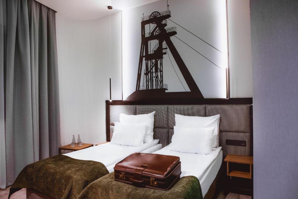 Postel nebo postele na pokoji v ubytování Hotel M23