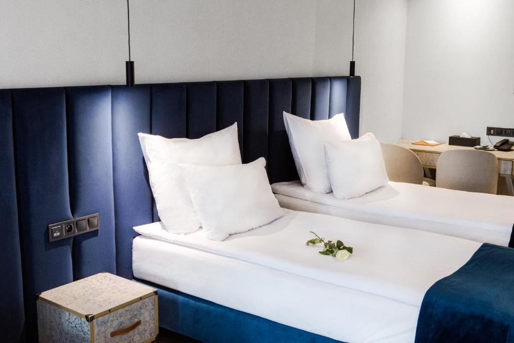 Postel nebo postele na pokoji v ubytování Hotel M23
