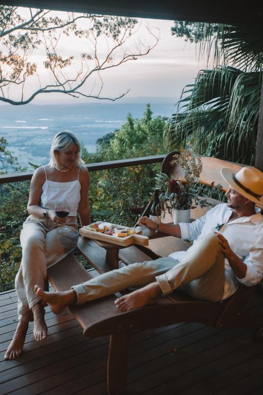 a group of people sitting on a picnic table at The Polish Place in Mount Tamborine