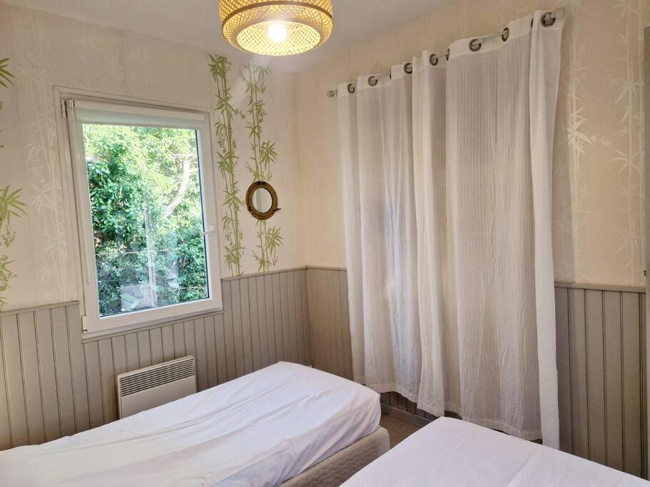 Postel nebo postele na pokoji v ubytování Les Capucines