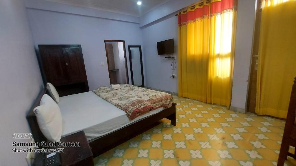 Postel nebo postele na pokoji v ubytování Rani Mahal Hotel