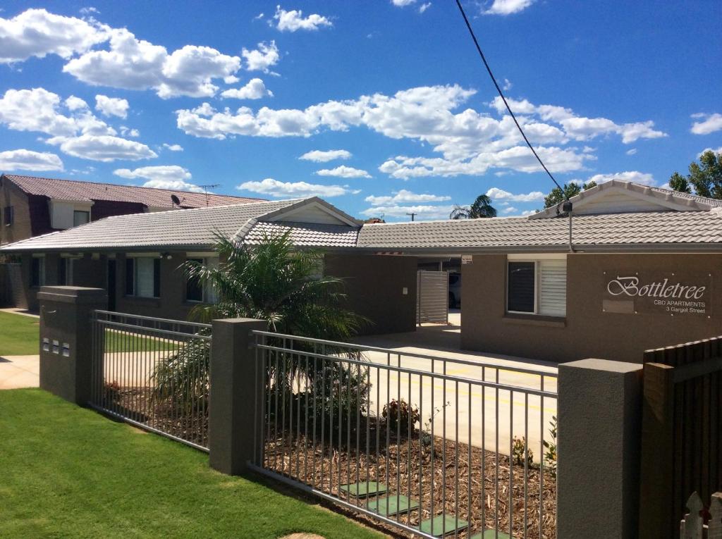 a house with a fence in front of it at Bottletree Apartments on Garget in Toowoomba