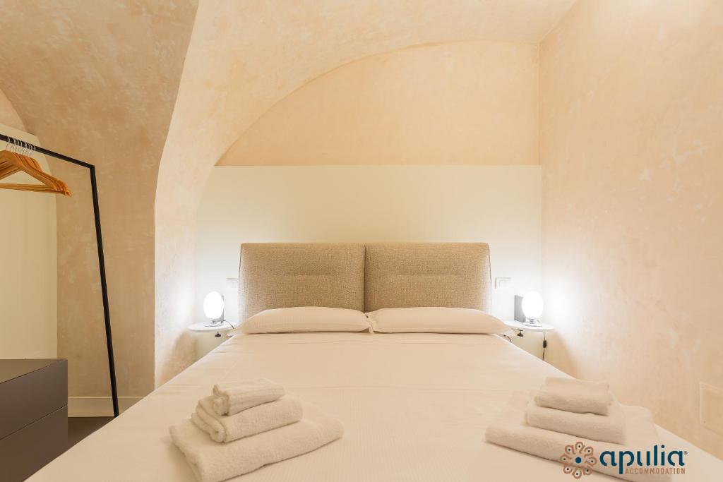 Posteľ alebo postele v izbe v ubytovaní Zema Home by Apulia Accommodation