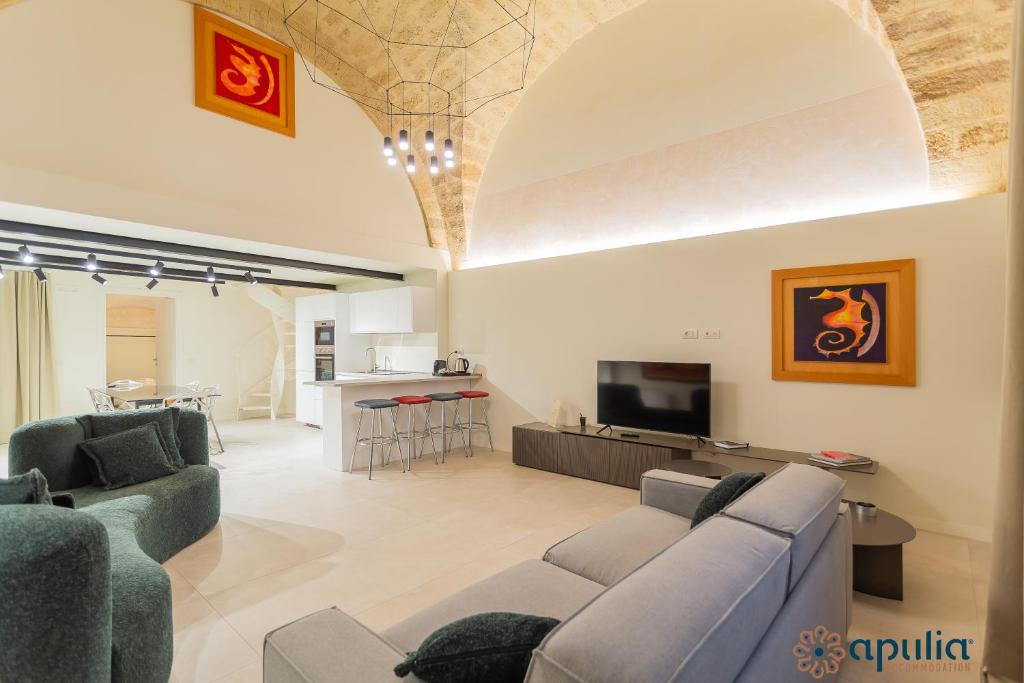 Televízia a/alebo spoločenská miestnosť v ubytovaní Zema Home by Apulia Accommodation