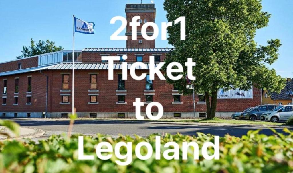 a brick building with the words for ticket to leopotland at Danhostel Grindsted-Billund in Grindsted