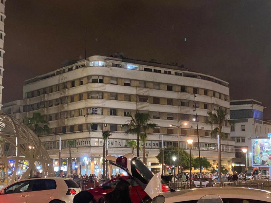 a large building with cars parked in front of it at اقامة الهام in Casablanca