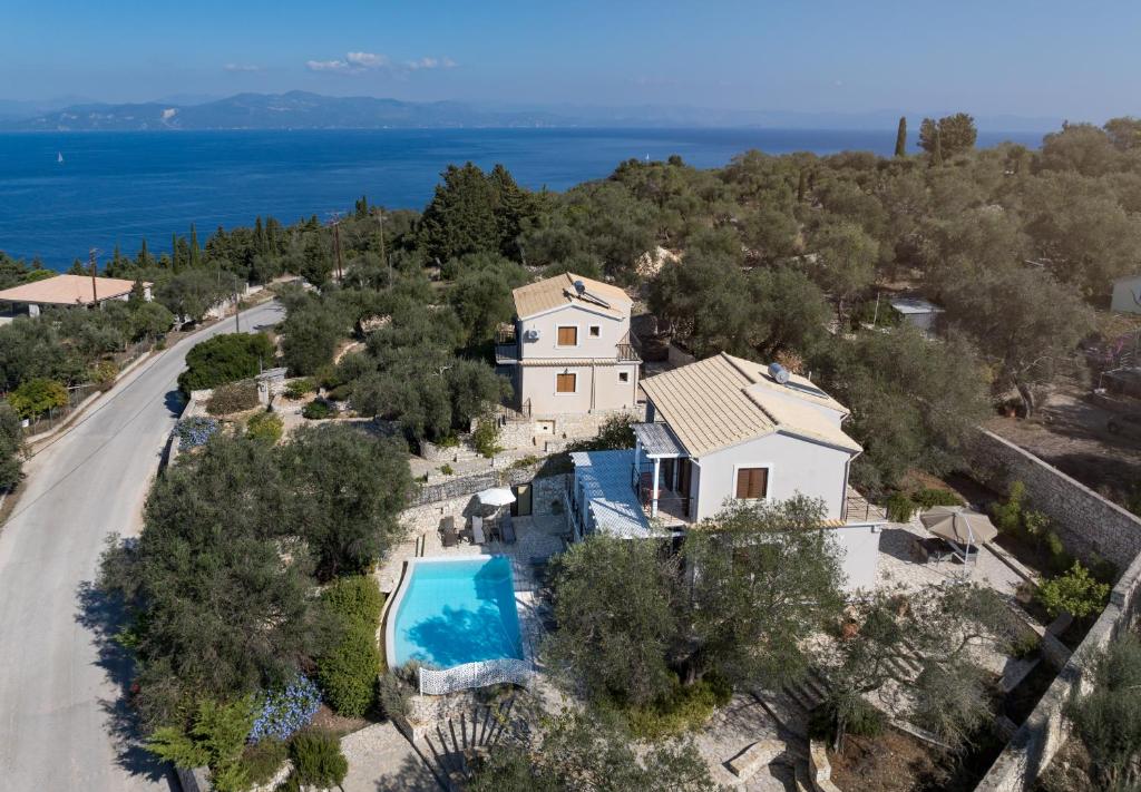 an aerial view of a house with a swimming pool at VILLA BOUGARINI in Ieromónachos