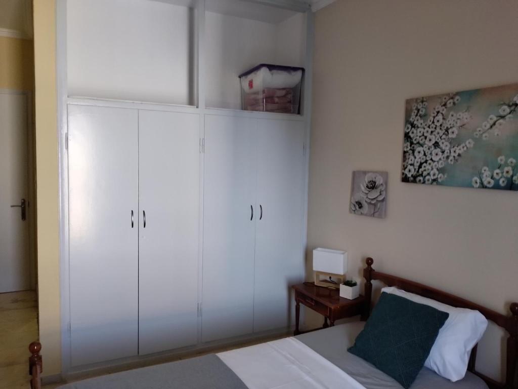 Postel nebo postele na pokoji v ubytování Jimmy's Apartments