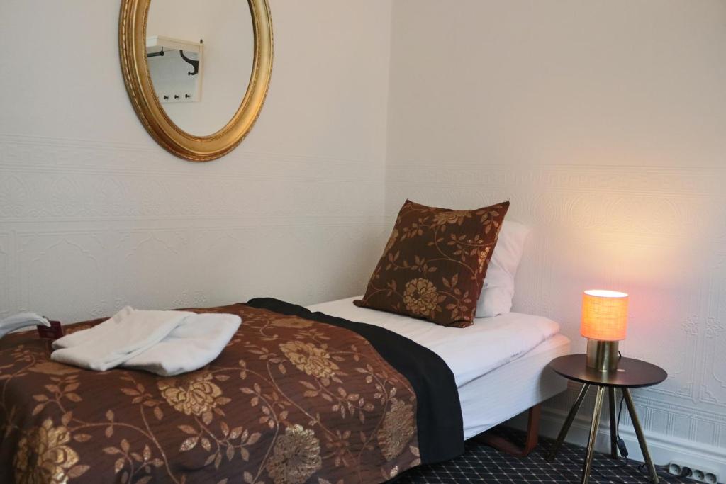 Postel nebo postele na pokoji v ubytování Milling Hotel Saxildhus