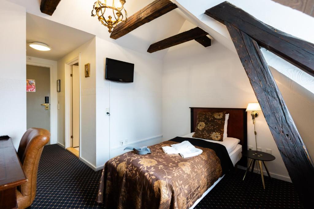 TV a/nebo společenská místnost v ubytování Milling Hotel Saxildhus