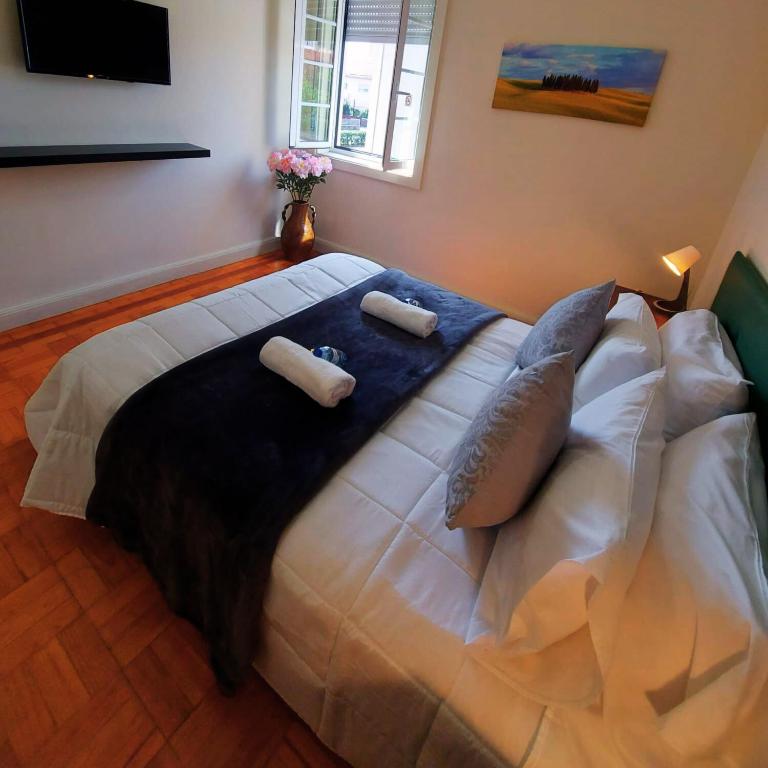 Postel nebo postele na pokoji v ubytování Imaculada Home Royal - Centro de Braga, Historico