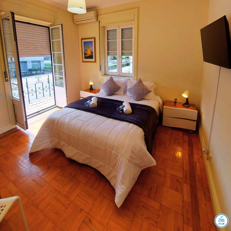 Postel nebo postele na pokoji v ubytování Imaculada Home Royal - Centro de Braga, Historico