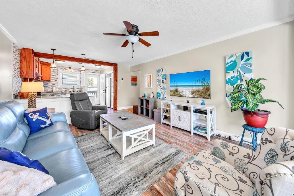 a living room with a couch and a table at Misty Harbour 7 in Panama City Beach