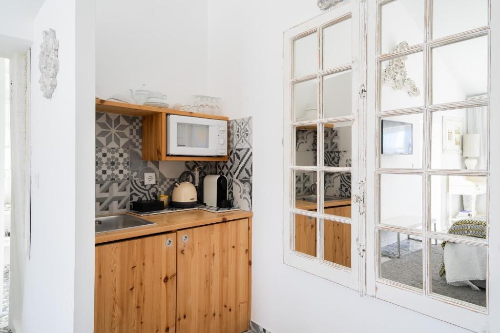 Kuchyň nebo kuchyňský kout v ubytování CoimbraAmeias