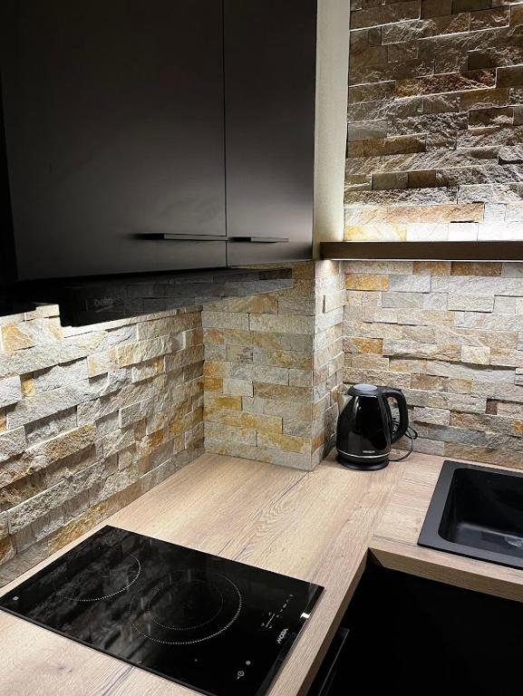 Kuchyň nebo kuchyňský kout v ubytování Apartmány Vlachovice