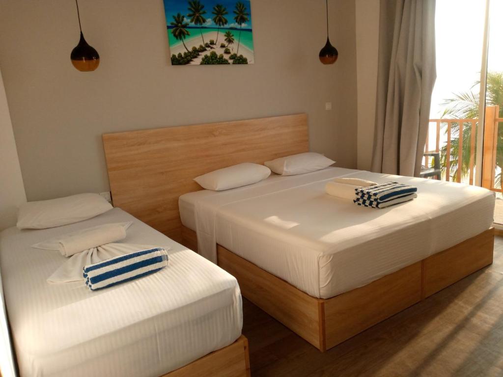 Postel nebo postele na pokoji v ubytování The Sunset Villa
