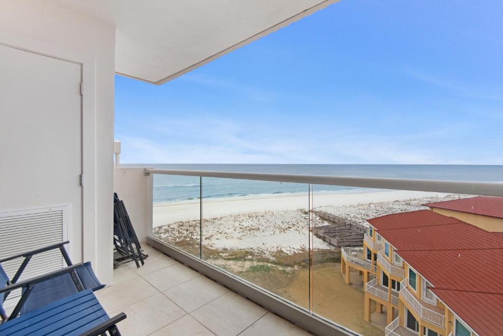 a balcony with a view of the beach at Regency Towers 808 West in Pensacola Beach
