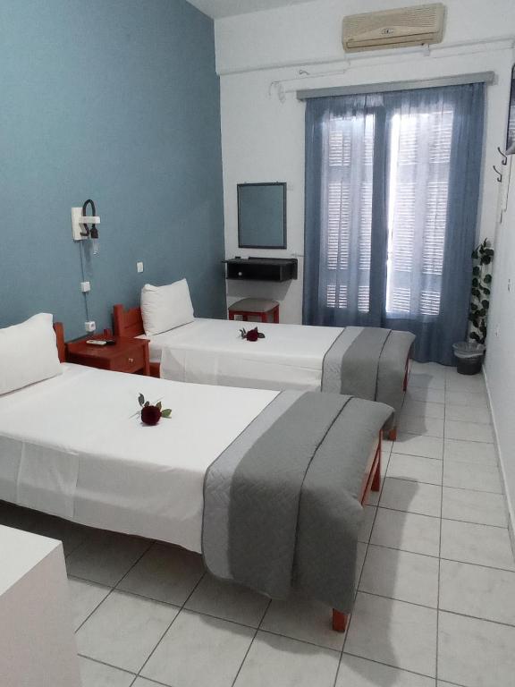 Postel nebo postele na pokoji v ubytování Hotel Theoxenia