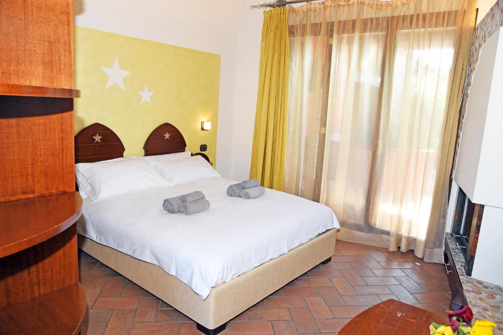 Postel nebo postele na pokoji v ubytování Agriturismo La Pecora Nera