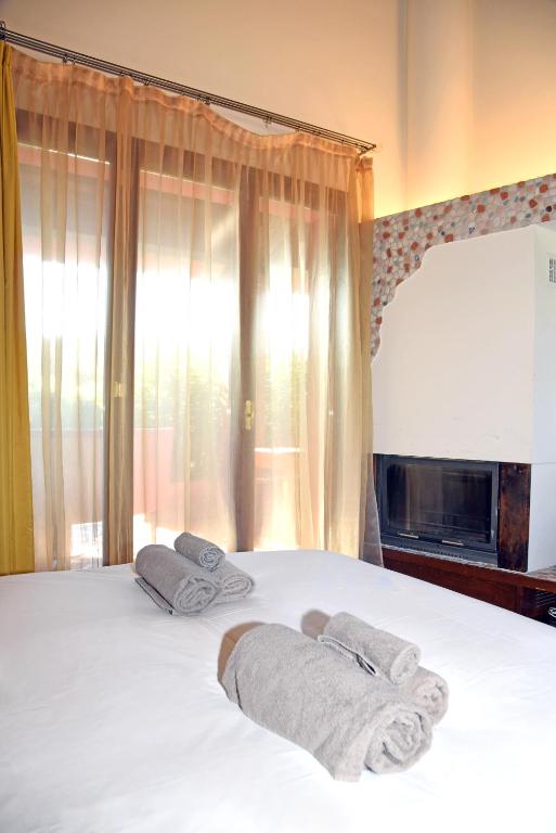 Postel nebo postele na pokoji v ubytování Agriturismo La Pecora Nera