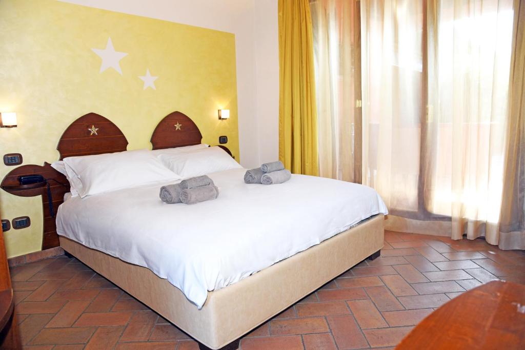 Postel nebo postele na pokoji v ubytování Agriturismo La Pecora Nera