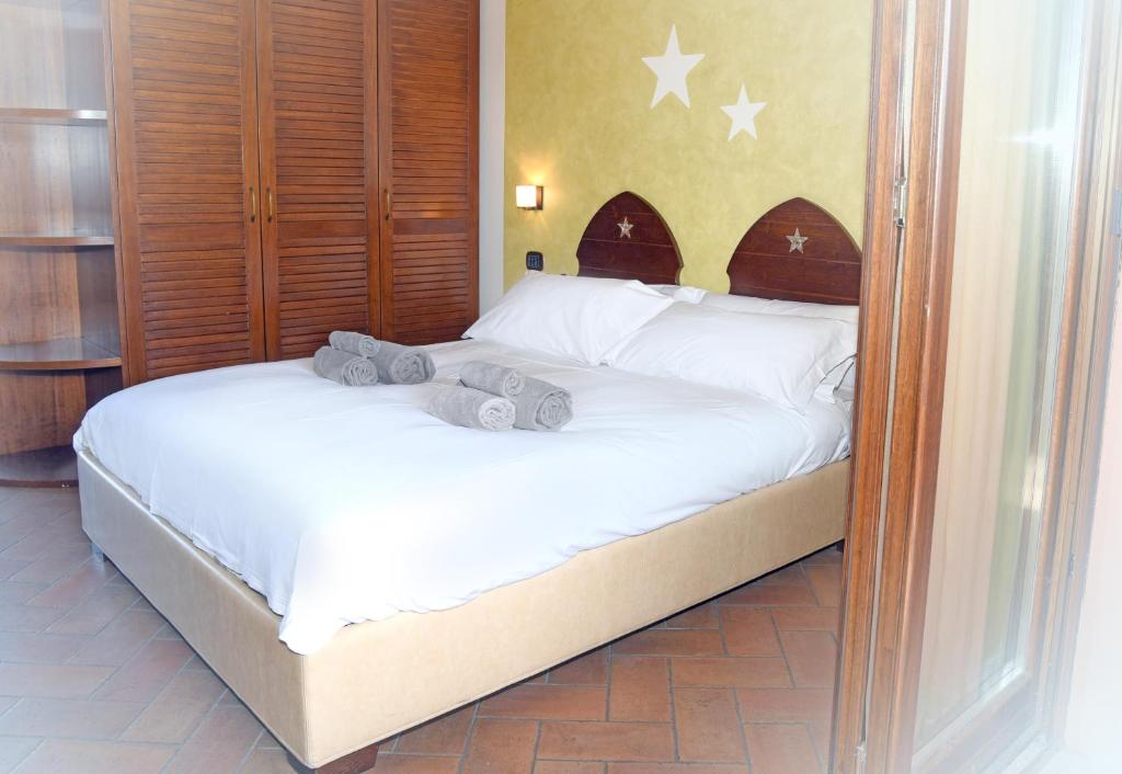 Postel nebo postele na pokoji v ubytování Agriturismo La Pecora Nera