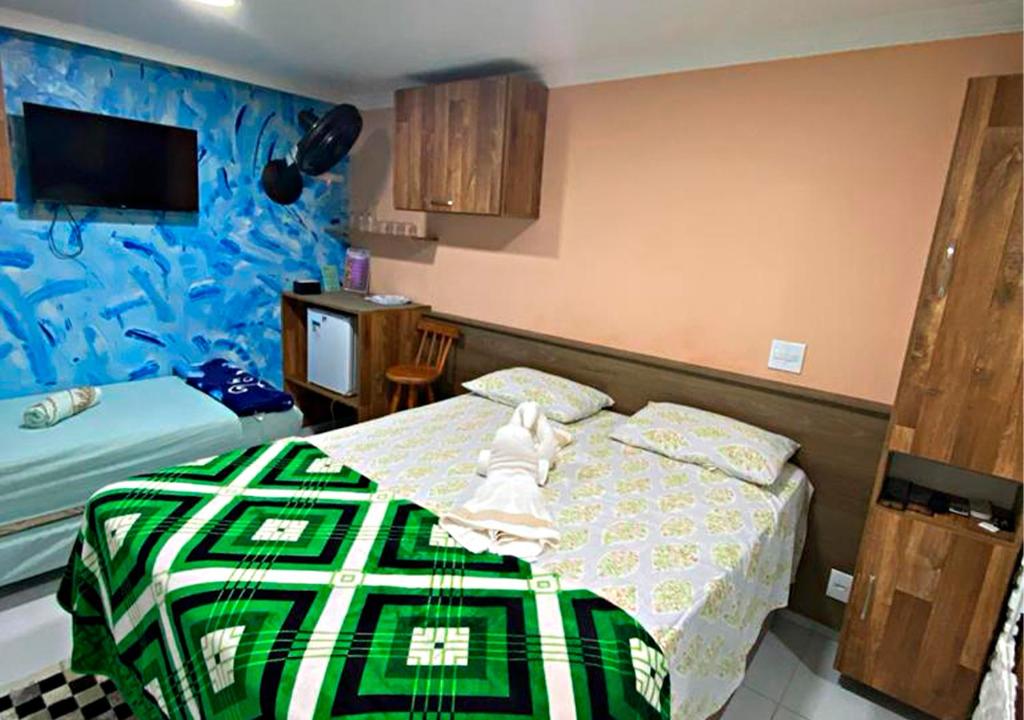 Postel nebo postele na pokoji v ubytování Pousada Amigos do Caetés