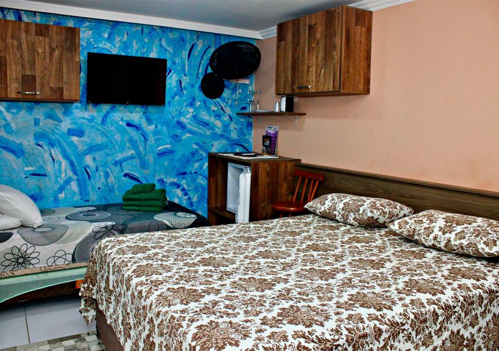 Postel nebo postele na pokoji v ubytování Pousada Amigos do Caetés