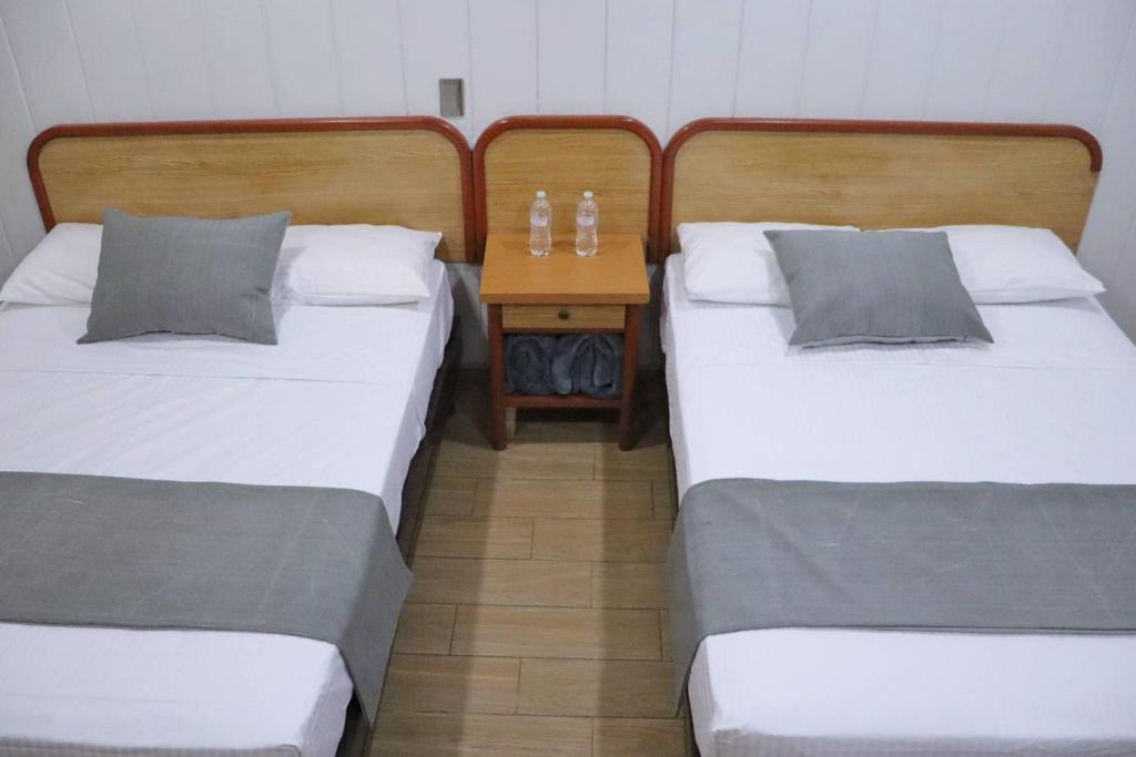 Postel nebo postele na pokoji v ubytování Hotel Riviera