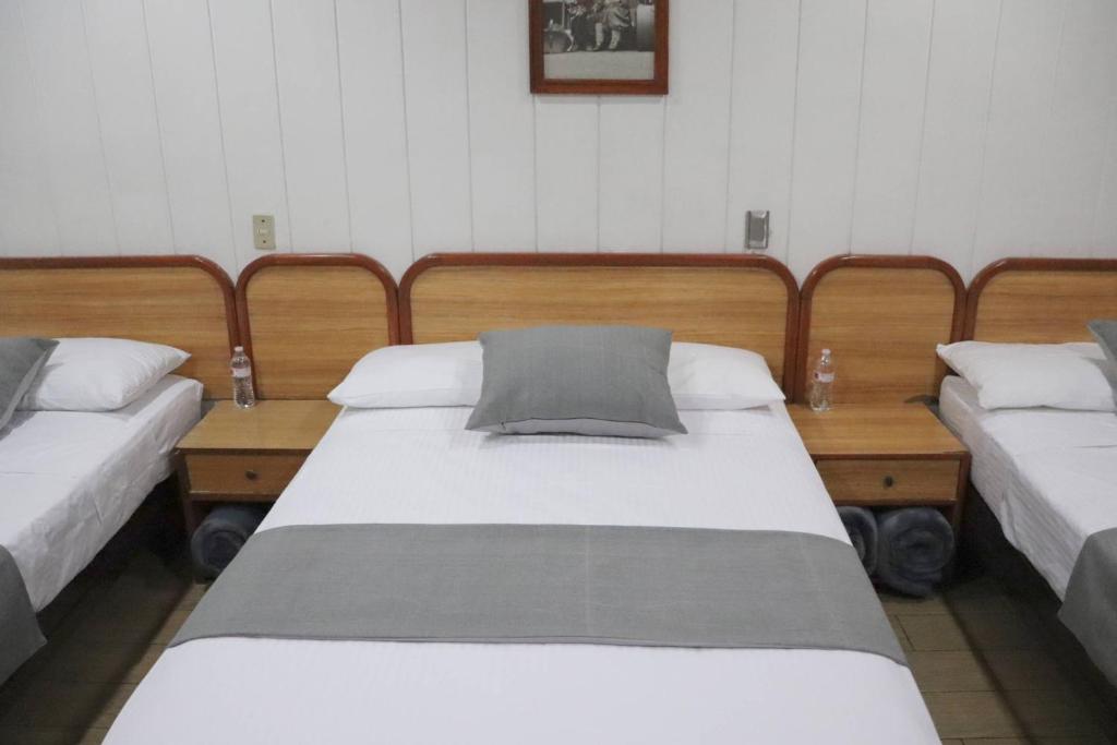 Postel nebo postele na pokoji v ubytování Hotel Riviera