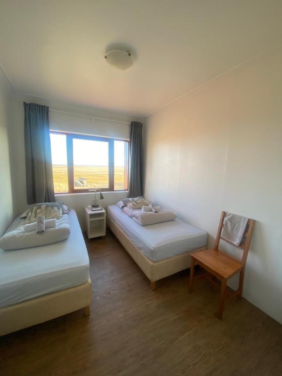 Postel nebo postele na pokoji v ubytování Guesthouse Nypugardar
