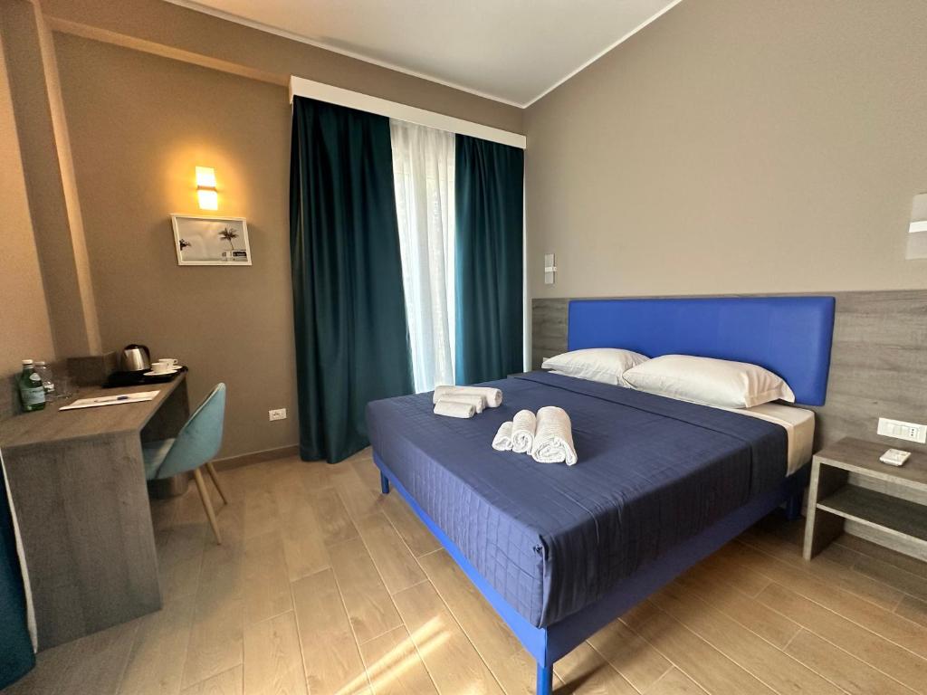 Postel nebo postele na pokoji v ubytování Sunset Guest House