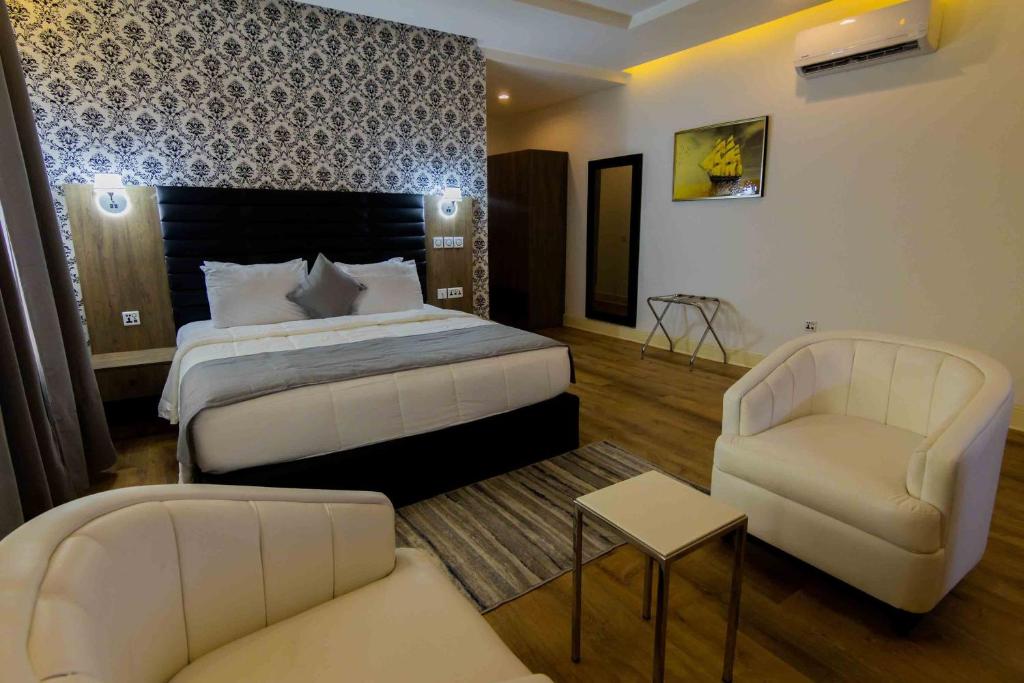 Postel nebo postele na pokoji v ubytování Crownsville Hotel - Airport Road