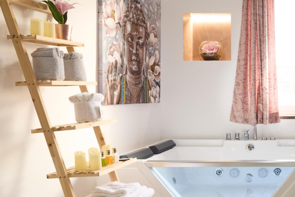 a bathroom with a tub and a sink at Napoli Central Lumina Suites in Naples