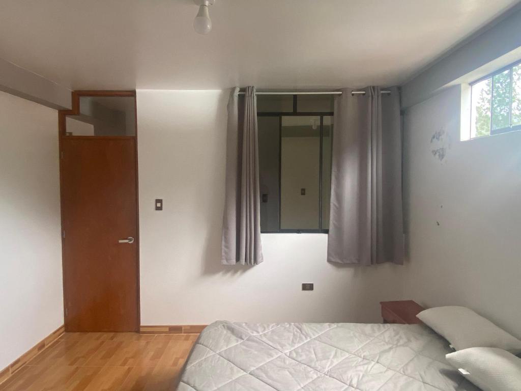 Postel nebo postele na pokoji v ubytování Casa Hospedaje El Trebol
