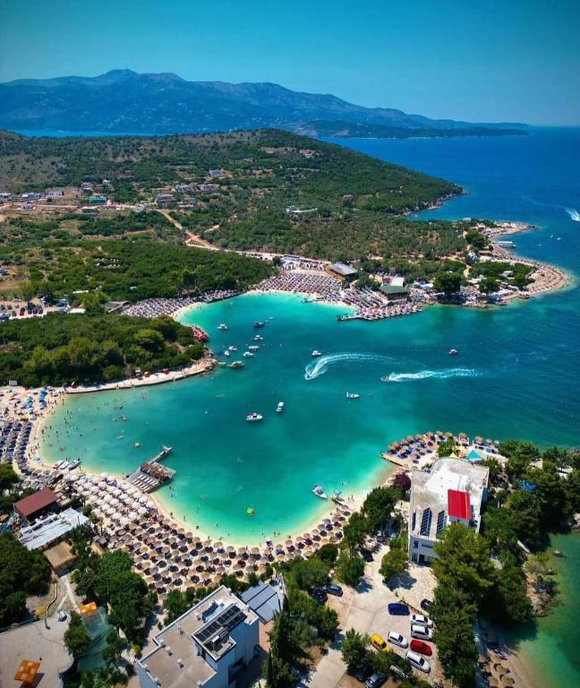 an aerial view of a beach with boats in the water at Guest House Bledar in Ksamil