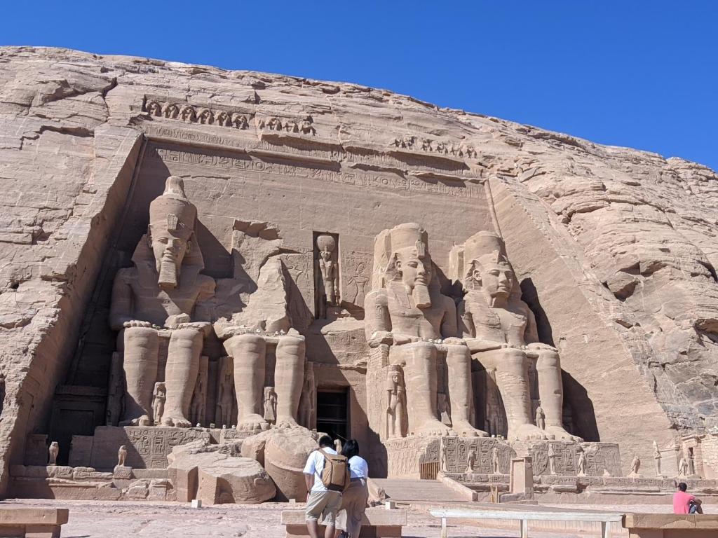 a large building with people standing in front of it at Skaam in Abu Simbel