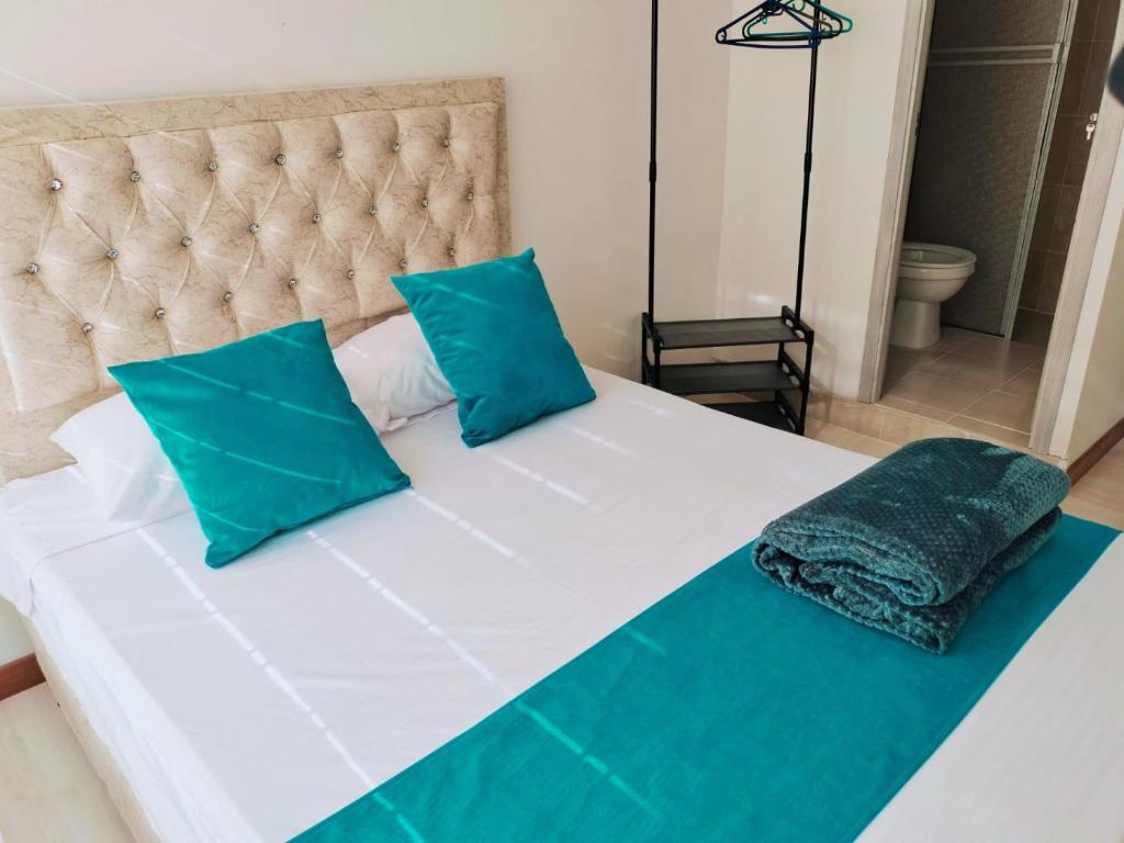 Postel nebo postele na pokoji v ubytování Hotel Batan-127