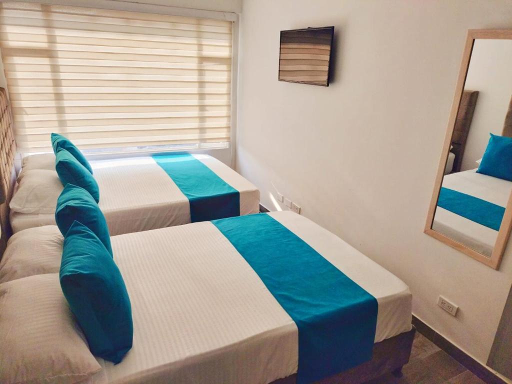 Postel nebo postele na pokoji v ubytování Hotel Batan-127