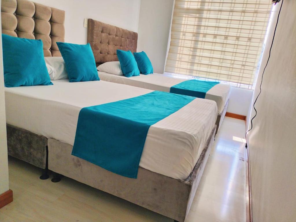 Postel nebo postele na pokoji v ubytování Hotel Batan-127