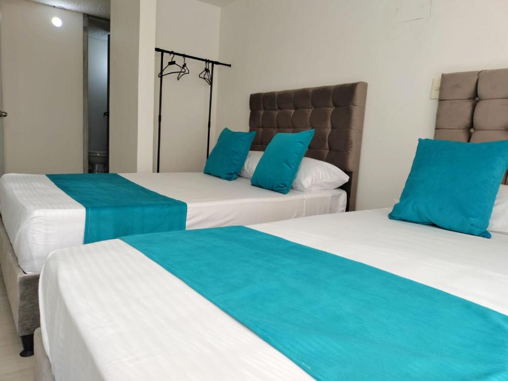 Postel nebo postele na pokoji v ubytování Hotel Batan-127