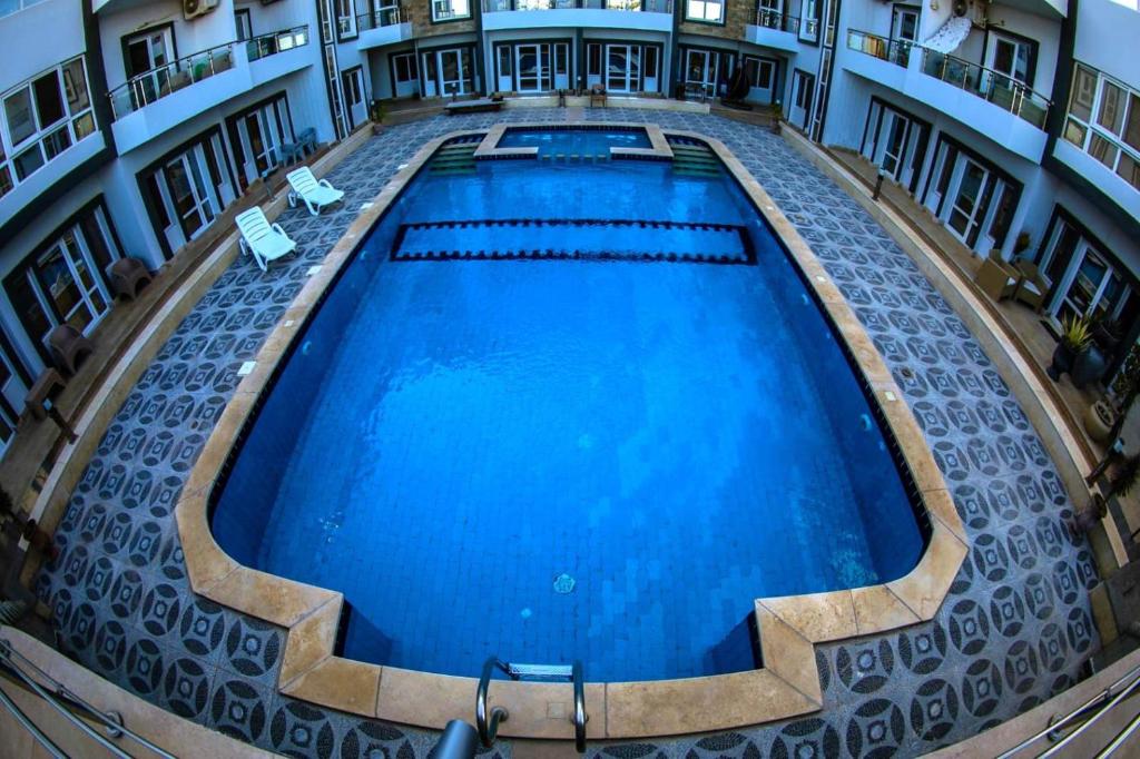 an overhead view of a large swimming pool in a building at Ryan Apartments in Hurghada