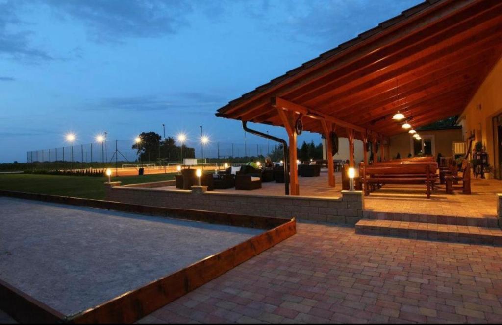 a pavilion with a bench and a pavilion at Karlov Dvor apartmány in Trnava