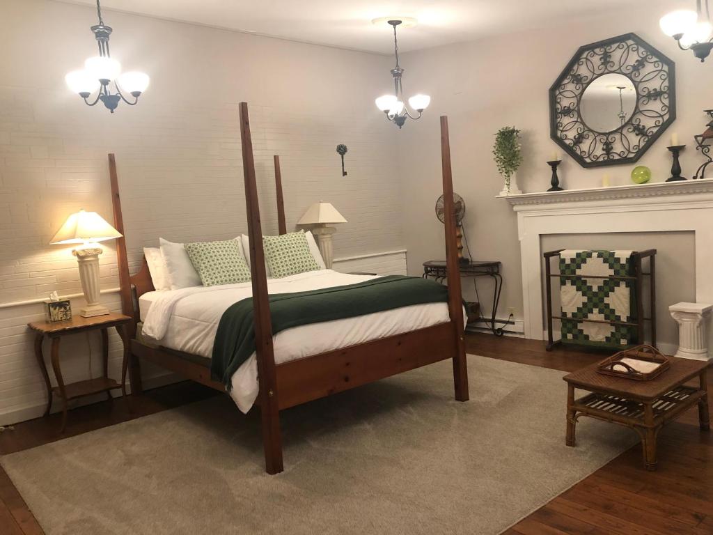 a bedroom with a large bed and a fireplace at Serene Suite by Taconic Ridge, Catamount, Tanglewood, Berkshires in Hillsdale