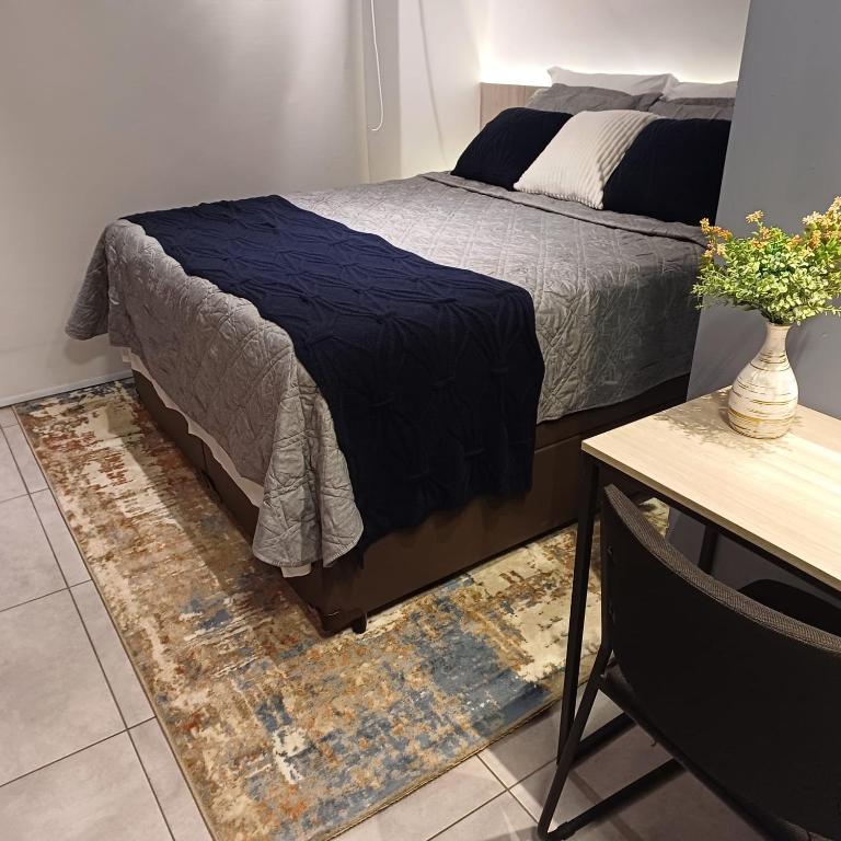 Postel nebo postele na pokoji v ubytování Metrô Studio Blem Belenzinho