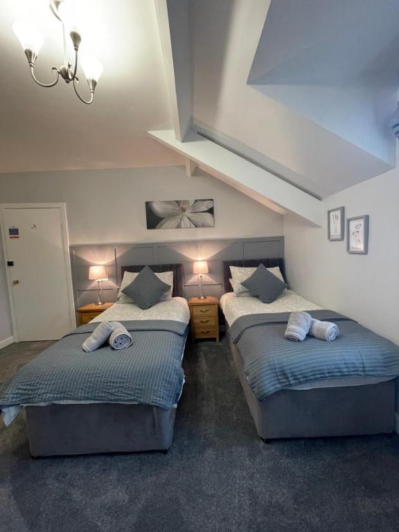 Кровать или кровати в номере Rivendell Guest House